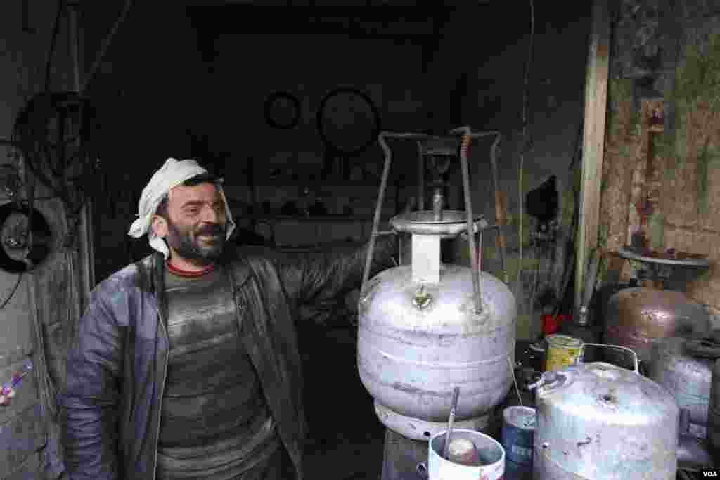 A man sells gas stoves in Aleppo, Syria, Feb. 28, 2013. 