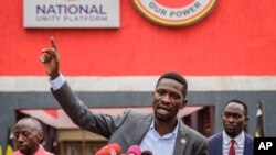 FILE - Ugandan opposition figure Robert Kyagulanyi, better known as Bobi Wine, speaks at a press conference in Kampala, Uganda, Feb. 22, 2021.