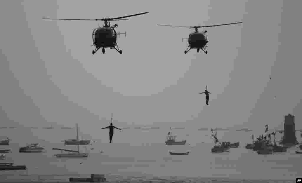 Indian Navy Commandos show their skills during Naval Day celebrations at the Arabian Sea in Mumbai, India. Navy Day is celebrated on Dec. 4.