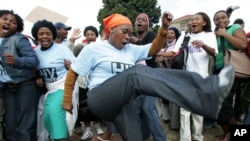 FILE - Treatment Action Campaign supporters chant and dance during a protest demonstration in Cape Town, South Africa.