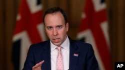 FILE - Then-Health Secretary Matt Hancock speaks at a press conference inside 10 Downing Street on further restrictions to be put in place because of the coronavirus pandemic, in London, Dec. 23, 2020.