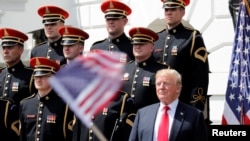 U.S. President Donald Trump participates in a "celebration of the American flag" event on the South Lawn of the White House in Washington, June 5, 2018.