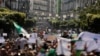 People march to protest against President Abdelaziz Bouteflika's plan to extend his 20-year rule by seeking a fifth term in April elections in Algiers, Algeria, March 1, 2019.