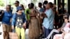 FILE - Traditional dancers perform to attract tourists at a shopping mall in downtown Suva, Fiji, on Dec. 15, 2022. Seven foreigners have been hospitalized after drinking cocktails at a five-star Fiji hotel resort, health officials said on Dec. 15, 2024.