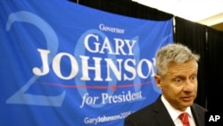 FILE - Libertarian presidential candidate Gary Johnson speaks to supporters and delegates at the National Libertarian Party Convention, in Orlando, Fla.