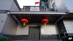The flag of China flies outside the Chinese Consulate General Wednesday, July 22, 2020, in Houston. 