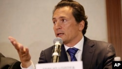 FILE - Emilio Lozoya, former head of Mexico's state-owned oil company Pemex, gives a press conference in Mexico City, Aug. 17, 2017.