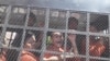 Opposition activists are being taken back to a detention center after Phnom Penh court postponed hearing, file photo. 