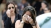 Mourners cry as they leave the funeral service for Anthony Luis Laureano Disla, one of the victims of the Pulse nightclub mass shooting, in Orlando, Florida, June 17, 2016.