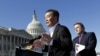 Rep. Chris Smith, R-N.J., right, listens as he and human rights activist Harry Wu, left, criticize the one-child rule in China, at the Capitol in Washington, Monday, March 7, 2011. 