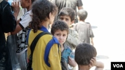 FILE - Authorities say children and wives of IS fighters are considered civilians, but other Mosul families often shun them. (H.Murdock/VOA)