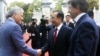 Chinese Premier Wen Jiabao, center, is greeted by Belgian PM Elio Di Rupo, right, and Belgian FM Didier Reynders prior to a meeting at the Egmont Palace in Brussels, September 20, 2012. 