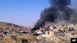 Smoke billows from Arsal, a Sunni Muslim town near the Syrian border in eastern Lebanon, Aug. 2, 2014.