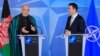 Afghanistan's President Hamid Karzai (L) and NATO Secretary General Anders Fogh Rasmussen make a joint statement before a meeting at NATO headquarters in Brussels, April 23, 2013.