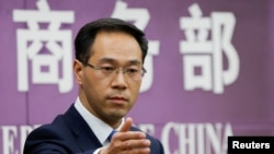 中国商务部发言人高峰（路透社2018年4月6日摄）