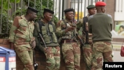 FILE: Soldiers are seen on the street in central Harare, Zimbabwe, Nov. 16, 2017. 