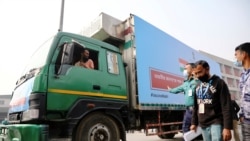A pickup van carries Oxford-Astrazeneca COVID-19 vaccines, which arrived from India as a gift to Bangladesh, from the Hazrat Shahjalal International Airport to the storage house, in Dhaka, Bangladesh January 21, 2021. REUTERS/Mohammad Ponir Hossain