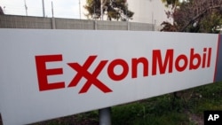 FILE - A sign for the ExxonMobil Torerance Refinery in Torrance, California, Jan. 30, 2012