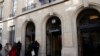 FILE - Students are seen outside Paris' Sciences Po university in Paris, France, March 15, 2016. 