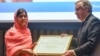 Malala Yousafzai attends a ceremony with United Nations Secretary-General Antonio Guterres after being selected a United Nations messenger of peace in New York, New York, April 10, 2017. 