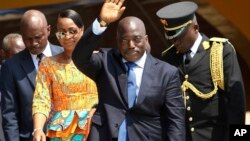 FILE - Congolese President Joseph Kabila, center, waves as he and others celebrate independence for the Democratic Republic of Congo in Kindu, Congo. 