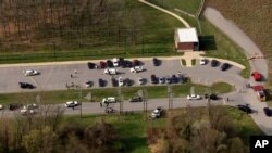 This photo provided by WJLA, police respond to the scene of a shooting in in Frederick, Md., on April 6, 2021.