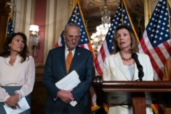 Speaker of the House Nancy Pelosi, D-Calif., right, speaks as Senate Minority Leader Chuck Schumer, D-N.Y., listens at the Capitol in Washington, Sept. 9, 2019.