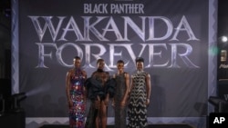 Florence Kasumba, from left, Danai Gurira, Letitia Wright and Lupita Nyong'o pose for photographers upon arrival for the premiere of the film 'Black Panther: Wakanda Forever' in London, Thursday, Nov. 3, 2022. (Photo by Vianney Le Caer/Invision/AP)