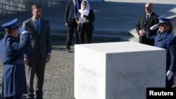 Serbia's Prime Minister Aleksandar Vucic (2nd L) attends an official ceremony at the Memorial Center Potocari, near Srebrenica, Bosnia and Herzegovina, Nov. 11, 2015.