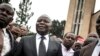 Vital Kamerhe, président de l'Union pour la Nation Congolaise (UNC), se tient devant la cathédrale après le service, le 12 janvier 2018. (AFP)