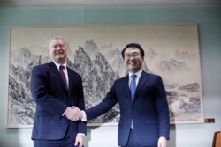 U.S. special envoy for North Korea Stephen Biegun, left, pose with his South Korean counterpart Lee Do-hoon during their meeting at the Foreign Ministry in Seoul, South Korea, Wednesday, Aug. 21, 2019.