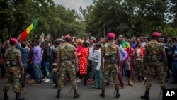 Ethiopian army soldiers attempt to control protestors from the capital and those displaced by ethnic-based violence over the weekend in Burayu, as they demonstrate to demand justice from the government in Addis Ababa, Ethiopia, Sept. 17, 2018. 