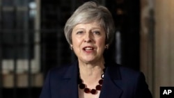 Britain's Prime Minister Theresa May delivers a speech outside 10 Downing Street in London, Nov. 14, 2018.