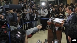 Tomas Ojea Quintana, UN human rights envoy to Burma, talks to journalists during a press conference at Rangoon International Airport, Burma, August 4, 2012.