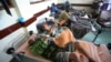 FILE - Cholera patients lie in beds in Budiriro clinic in Harare, Zimbabwe.