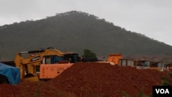 FILE - Mining equipment and piles of ore are seen at the Sino Africa Huijin mine in Penhalonga, Manicaland province, Zimbabwe, Sept. 17, 2024. (Enos Danher/VOA)