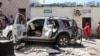The vehicle wreckage of Somalia's government spokesperson Mohamed Ibrahim Moalimuu is seen at the scene of an explosion Mogadishu, Jan. 16, 2022.