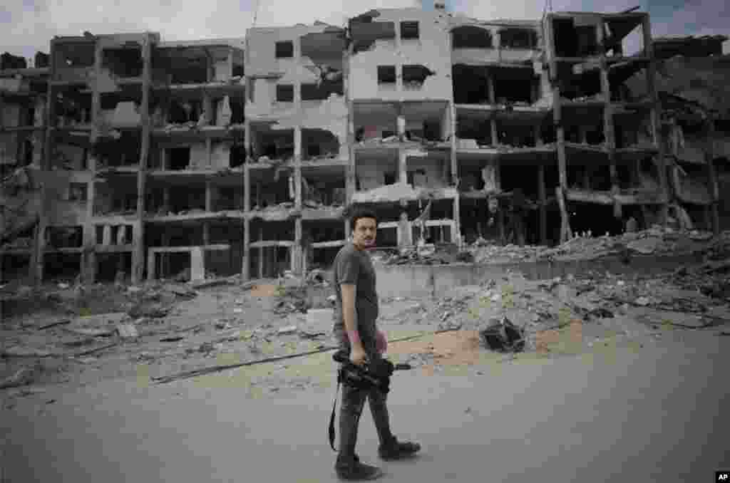 This Monday, Aug. 11 2014 photo shows Associated Press video journalist Simone Camilli in Beit Lahiya, Gaza Strip. Camilli, 35, was killed in an ordnance explosion in the Gaza Strip, on Wednesday, Aug. 13, 2014 together with Palestinian translator Ali She