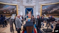 Organizers work to move the Inauguration Day swearing-in ceremony into the Capitol Rotunda due to expected frigid weather in Washington, Jan. 18, 2025. 