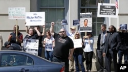 Opponents of House Bill 2 protest across the street from the North Carolina State Capitol in Raleigh, N.C., April 11, 2016.
