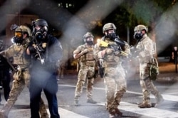 Federal agents disperse Black Lives Matter protesters near the Mark O. Hatfield United States Courthouse in Portland, Oregon, July 20, 2020.