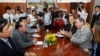 U.S. Deputy Assistant Secretary of State for Democracy, Human Rights, and Labor Scott Busby, second from right, talks with Cambodian Foreign Minister Hor Namhong, second from left, during a meeting inside, in Phnom Penh, Cambodia, Tuesday, June 2, 2015. S