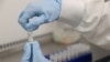 Para ilmuwan menguji coba potensial vaksin untuk Covid-19 di Cobra Biologics, Keele, Inggris, 30 April 2020.