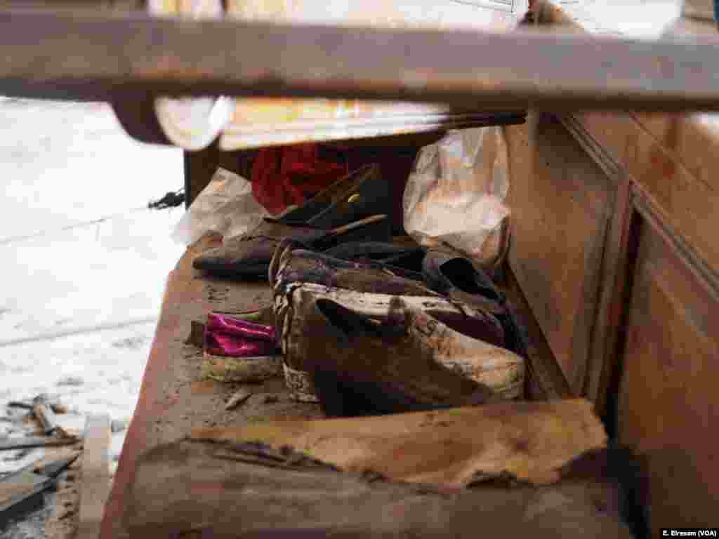 Shoes of injured are seen at the “Botrosia” church where the explosion took place in Cairo, Dec. 11, 2016. The explosion was on the women and children side of the church.