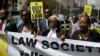Mercy Wambua (C), CEO of the Law Society of Kenya, and other lawyers march to demand that court orders and the law are respected, following the government's deportation last week of an opposition politician in defiance of a court order that he be produced in court, in downtown Nairobi, Kenya, Feb. 15, 2018. 