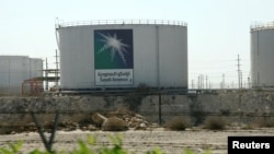 FILE - Oil tanks are seen at the Saudi Aramco headquarters in Damam city, Nov. 11, 2007. 