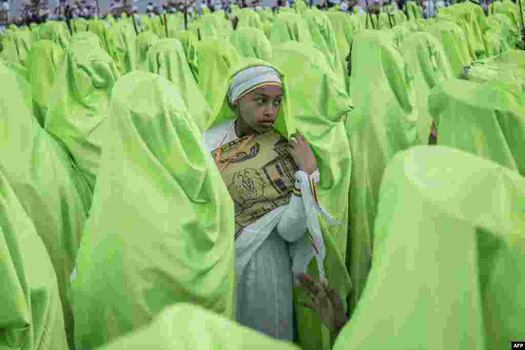 An Orthodox choir parade during the celebrations in the eve of the Ethiopian Orthodox holiday of Meskel, in Addis Ababa, Ethiopia, Sept. 26, 2022.