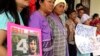 FILE - Karen activists in the northern province of Chiang Mai, hold a picture of Billy during a rally demanding authorities speed up the investigation and bring back their missing colleague Por Cha Lee Rakcharoen, known as "Billy" outside the governor's