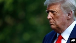 President Donald Trump walks on the South Lawn of the White House in Washington, July 15, 2020, after stepping off Marine One.
