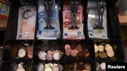 A shop cash register is seen with both sterling and euro currency in the till at the border town of Pettigo, Ireland, Oct. 14, 2016. 